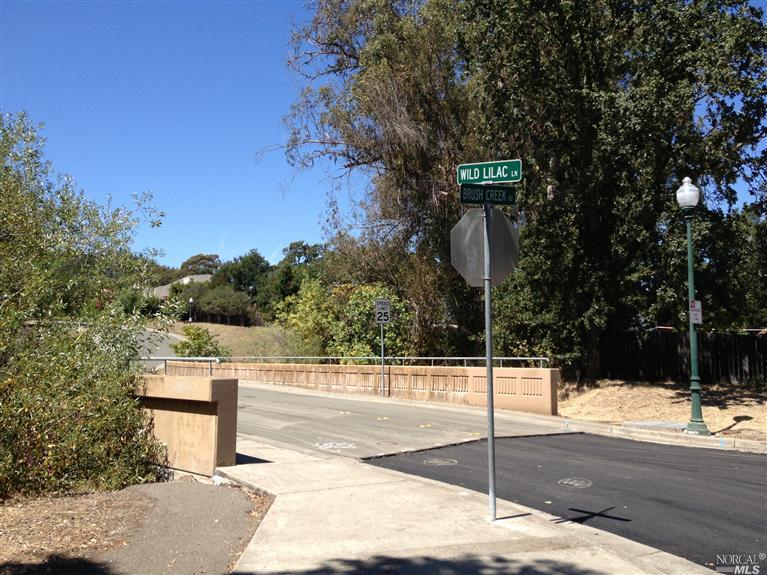 0 Brush Creek Road Santa Rosa, CA 95404 - Photo 1 of 1 a street sign on a sidewalk next to a road