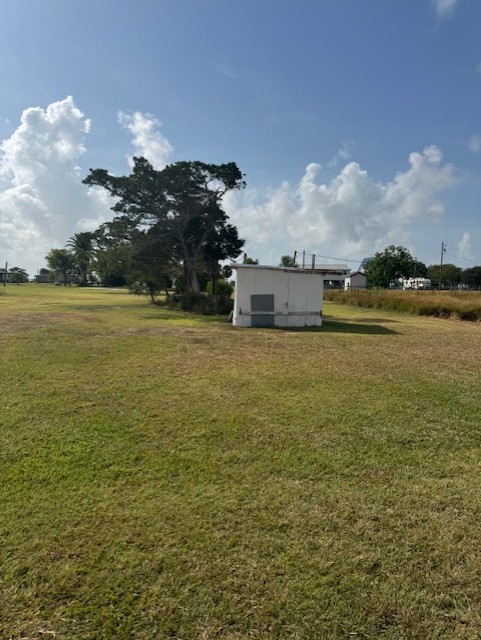 93 2nd Street Palacios, TX 77465 - Photo 20 of 24 a view of an ocean and beach
