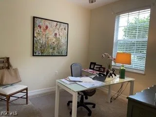 a view of a workspace with furniture