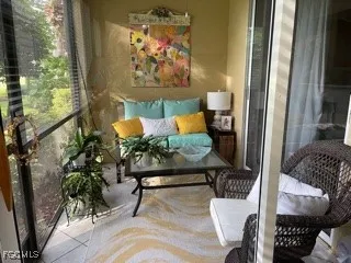a outdoor living room with furniture and a potted plant