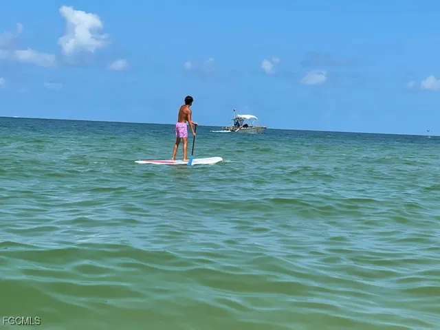a view of an ocean and city