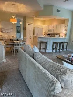 a living room with furniture and a table