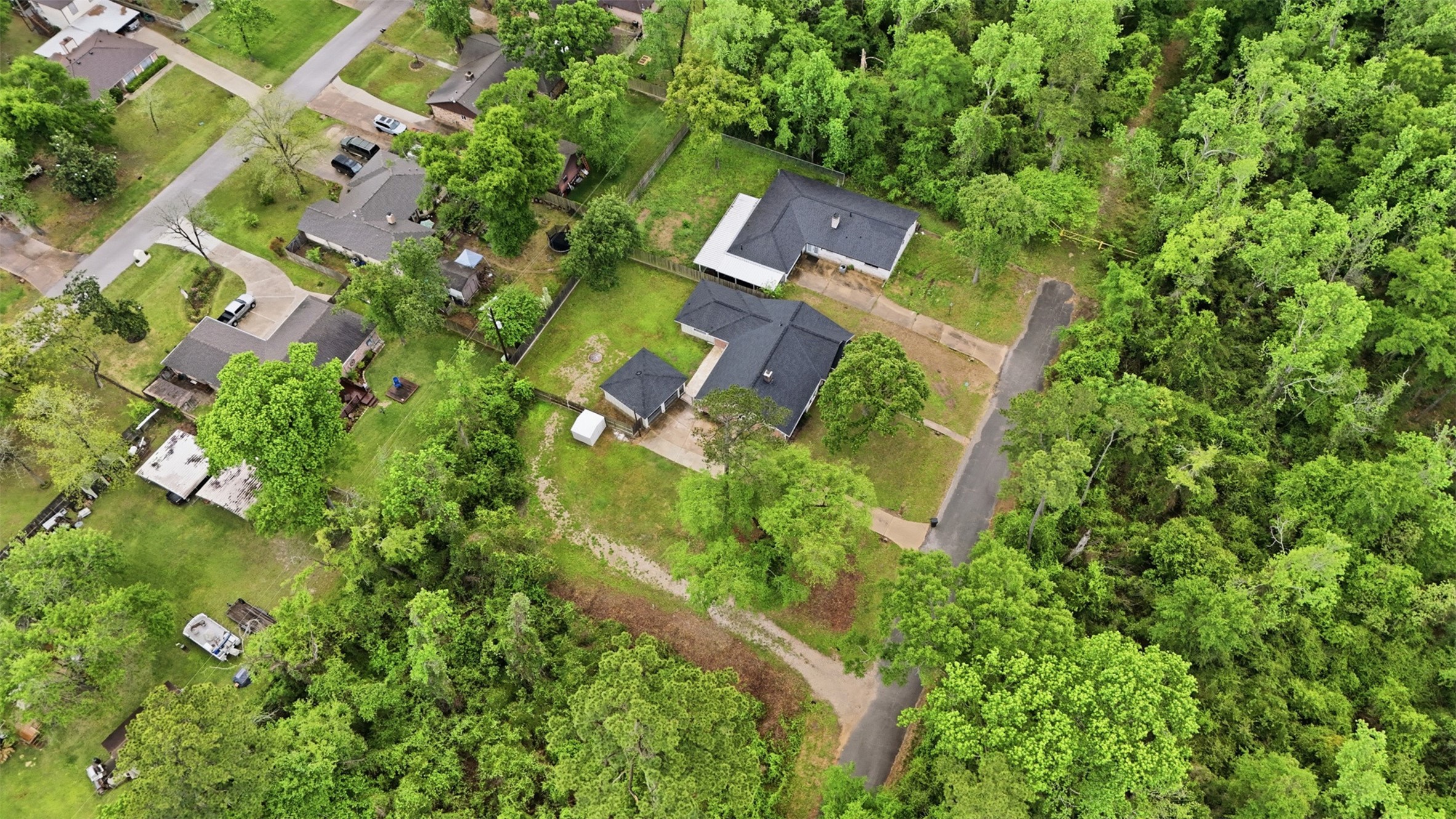24714 Hunters Hollow Drive Spring, TX 77380 - Photo 37 of 39 an aerial view of residential house with outdoor space and trees all around