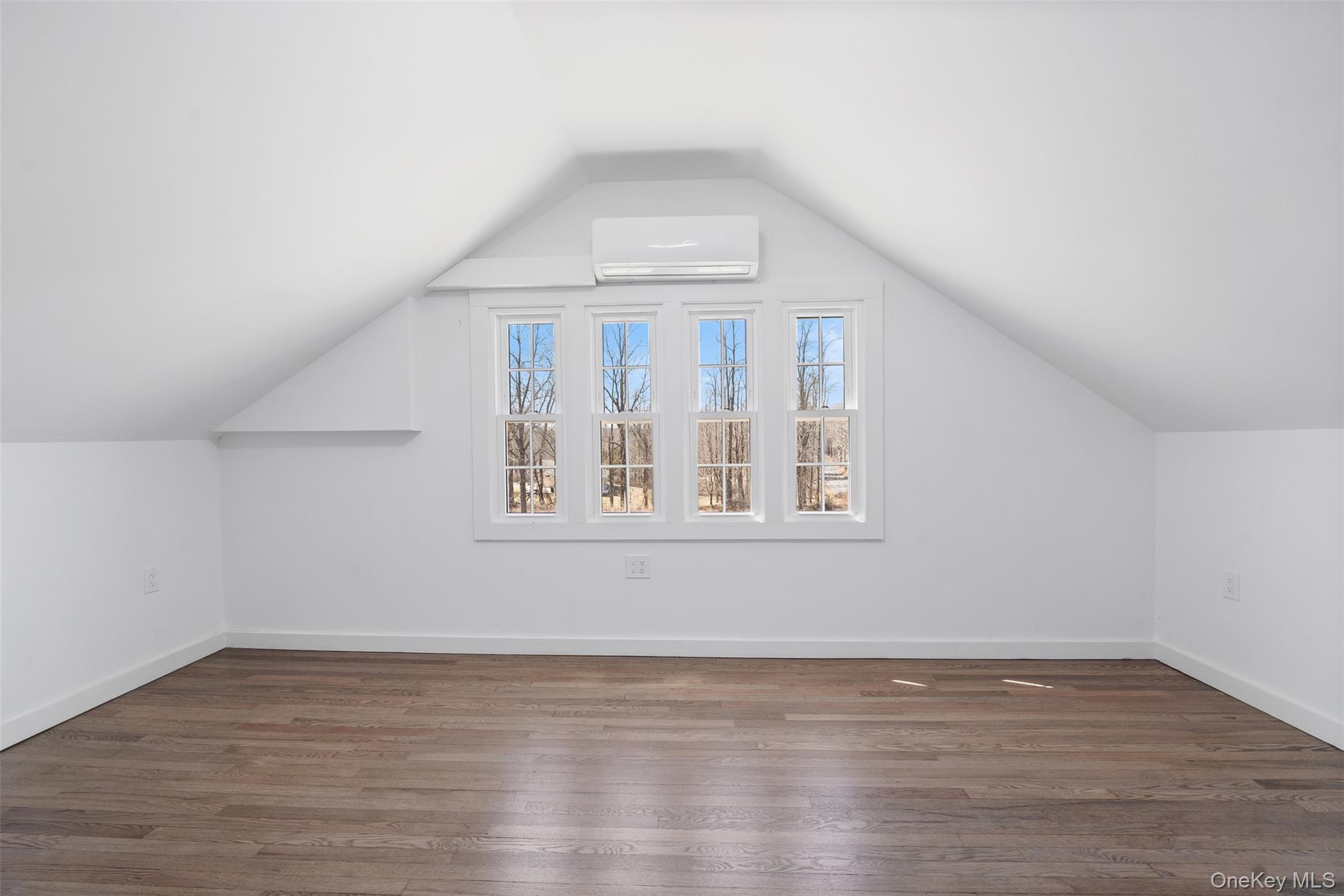 70 Barmore Road LaGrangeville, NY 12540 - Photo 23 of 47 Bonus room featuring a wall mounted AC, lofted ceiling, and wood finished floors