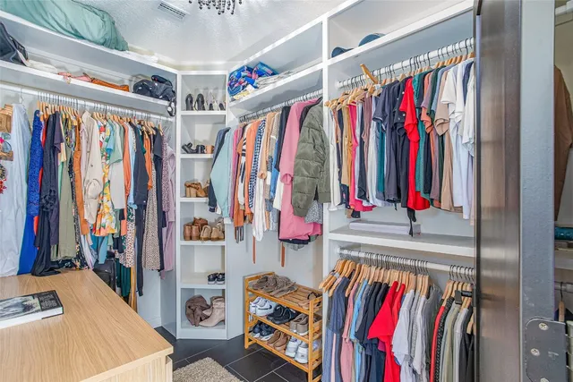 a bedroom with a bed and a desk