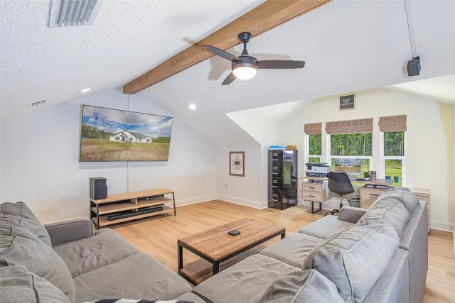 a swimming pool with outdoor seating and yard