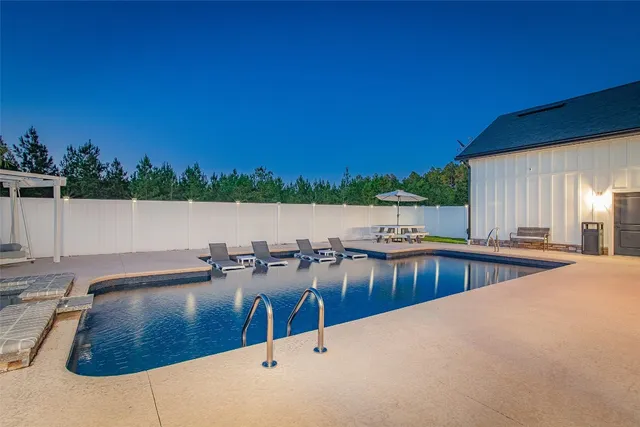 a view of a swimming pool with an outdoor space