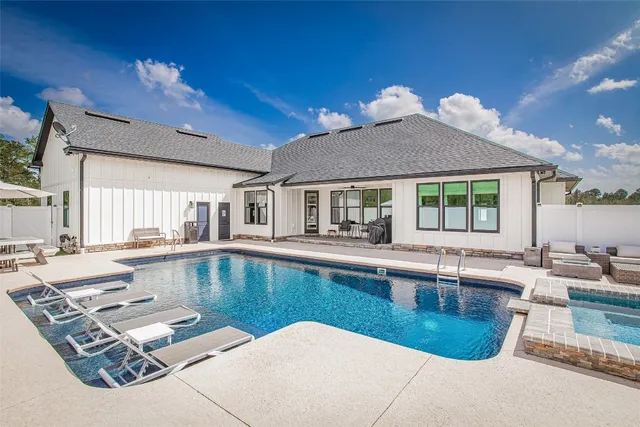 a view of a swimming pool with an ocean view