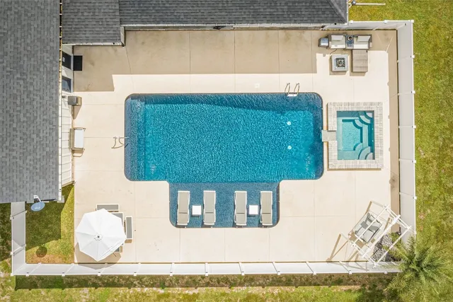 a view of a swimming pool from a balcony