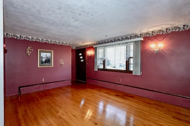 a view of a livingroom with wooden floor