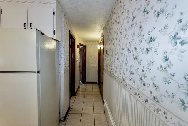 a bathroom with a sink toilet and mirror