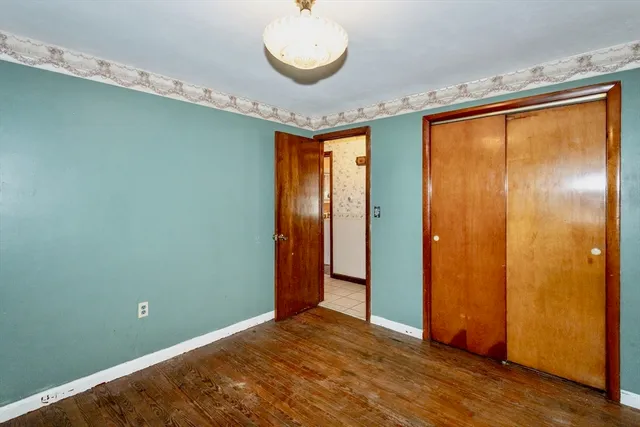 a view of a room with a sink and wooden floor