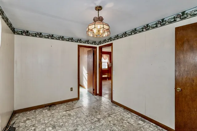 a view of a hallway with a chandelier