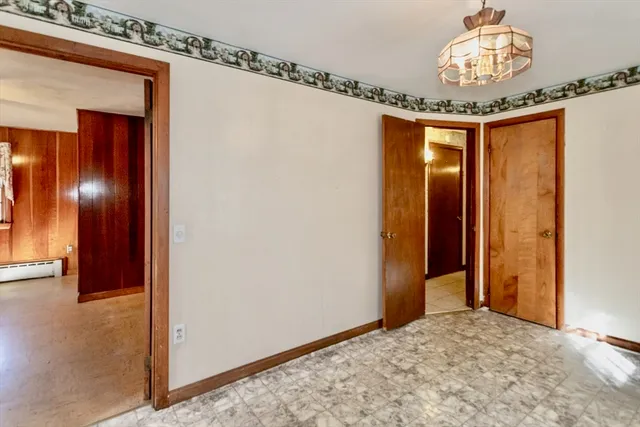 a view of a hallway to a bedroom