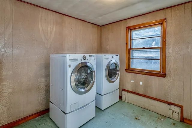 a utility room with sink dryer and washer