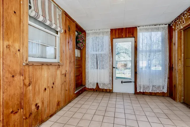 a view of an entryway with wooden door