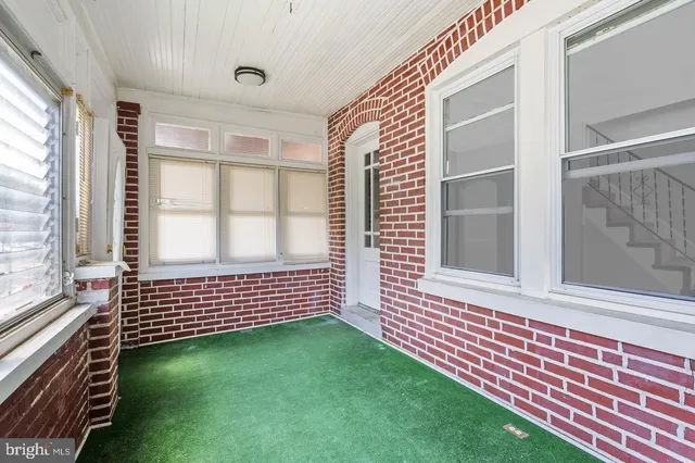 a view of a porch with a yard