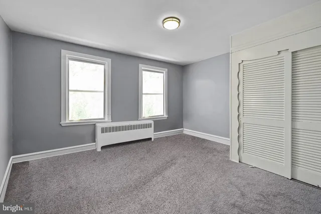 an empty room with windows