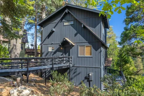 a view of a house with a tree