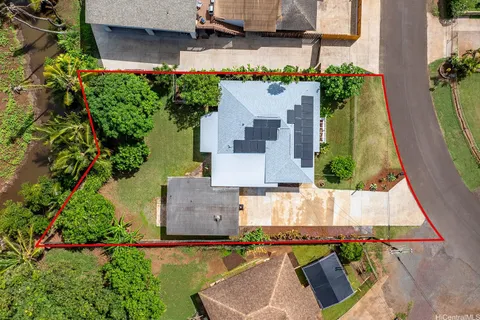 an aerial view of a house with a swimming pool