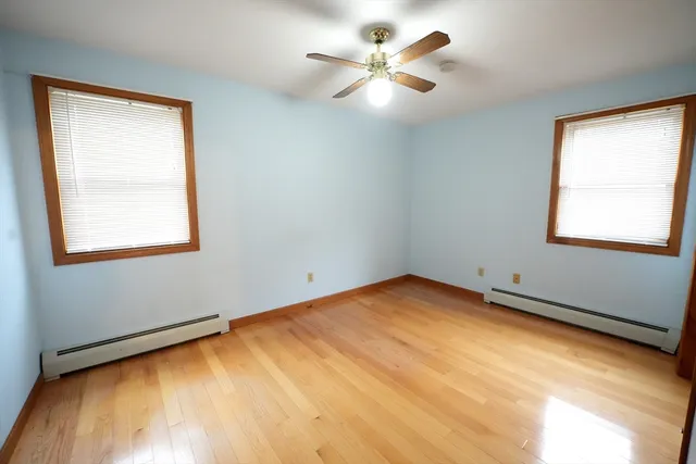a view of an empty room with windows