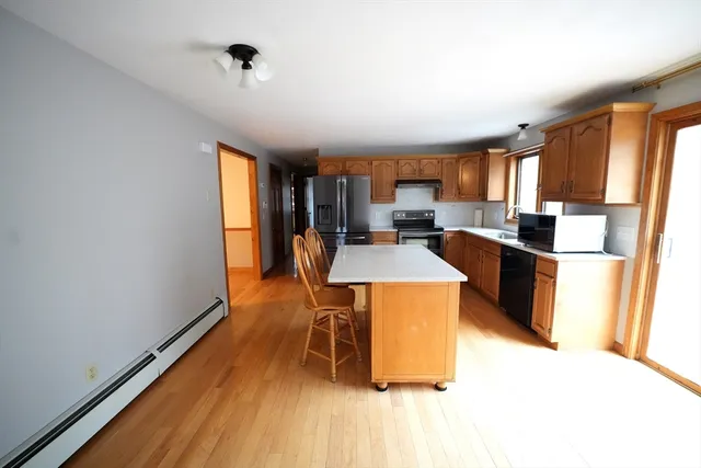 a view of an empty room and closet area