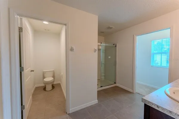 a view of a bathroom with a toilet and a sink
