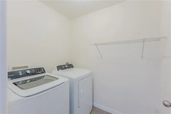 a view of an empty room with a glass door