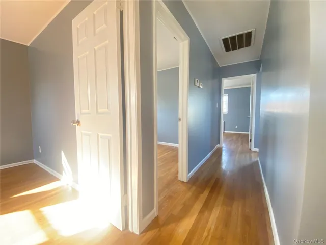 a view of balcony with wooden floor and fence
