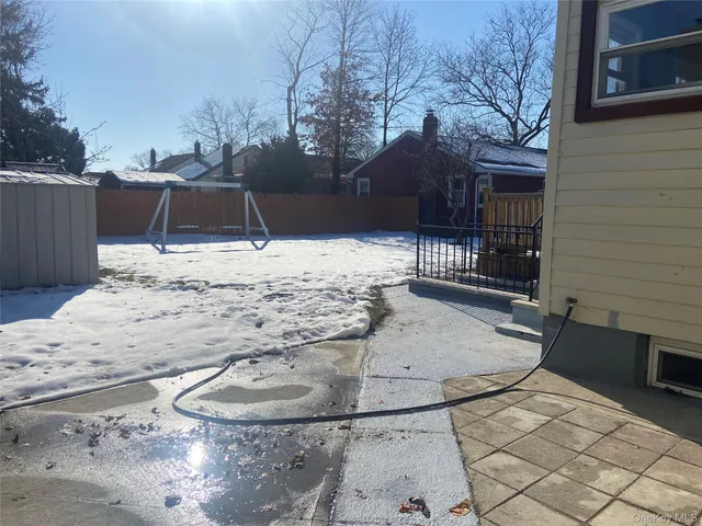 a kitchen with granite countertop cabinets and refrigerator