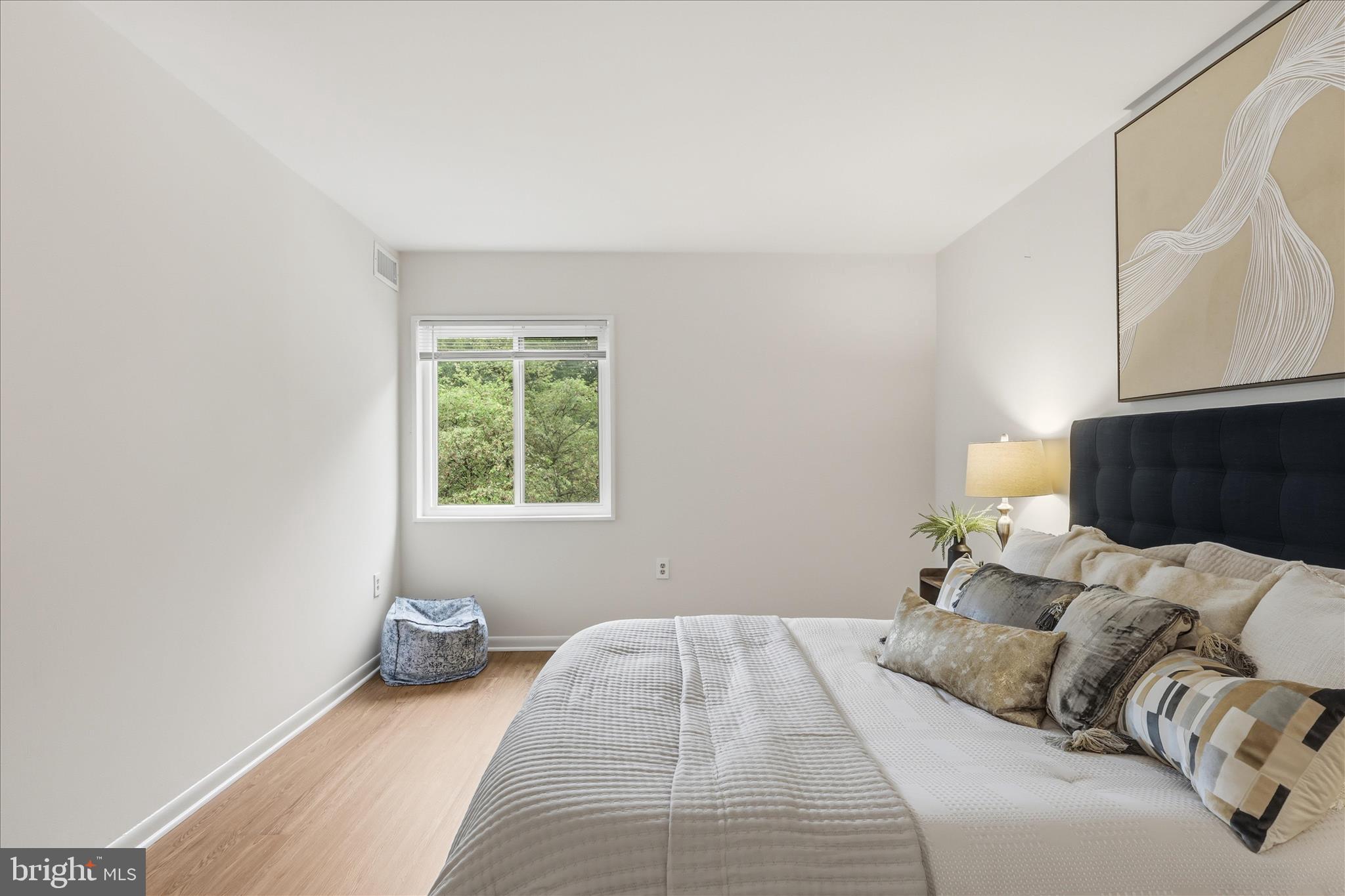 1540 Northgate Square, Unit 21B Reston, VA 20190 - Photo 13 of 24 a bedroom with a bed and a window