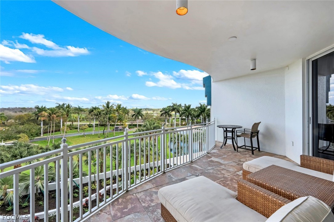 13675 Vanderbilt Drive, Unit 406 Naples, FL 34110 - Photo 27 of 43 a view of a city from a balcony