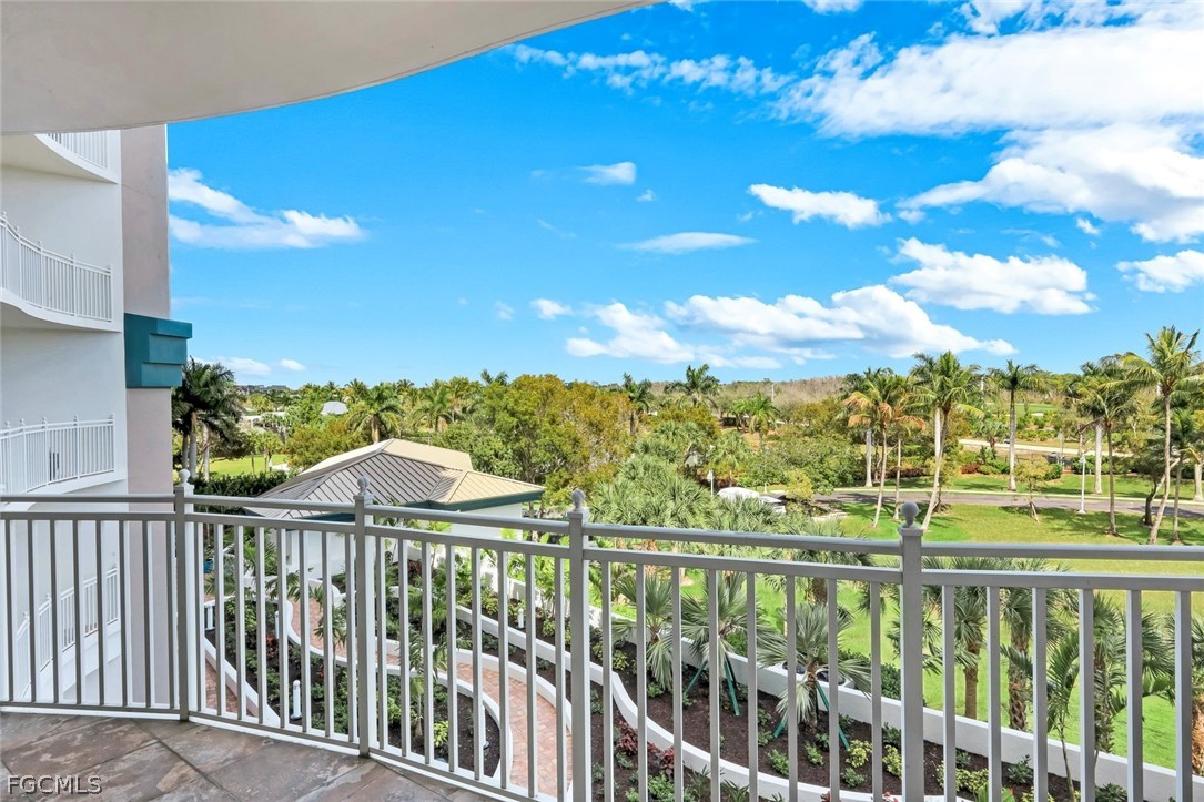 13675 Vanderbilt Drive, Unit 406 Naples, FL 34110 - Photo 28 of 43 a view of a city from a balcony
