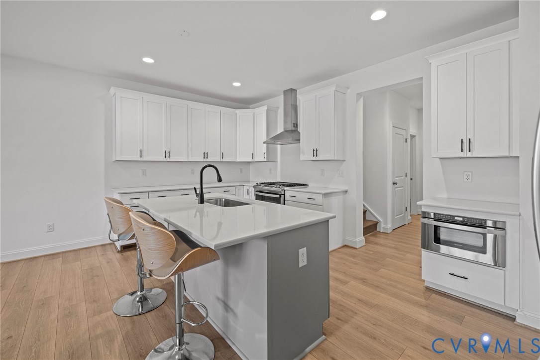 224 Lauradell Road Ashland, VA 23005 - Photo 21 of 74 Kitchen featuring a central island with a sink, wh