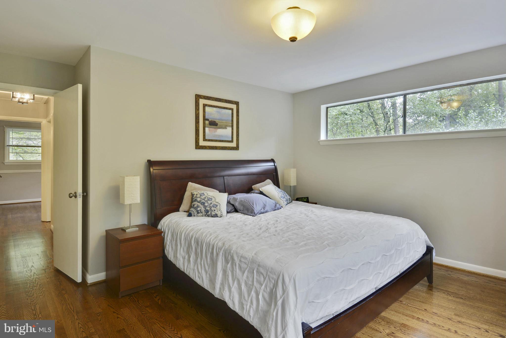 21 Parkside Road Silver Spring, MD 20910 - Photo 12 of 29 a bedroom with a bed and a painting on the wall