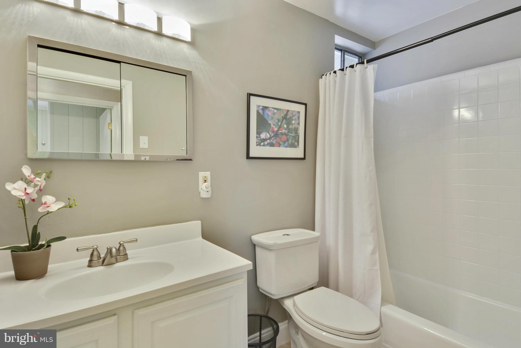 21 Parkside Road Silver Spring, MD 20910 - Photo 15 of 29 a bathroom with a toilet sink and mirror