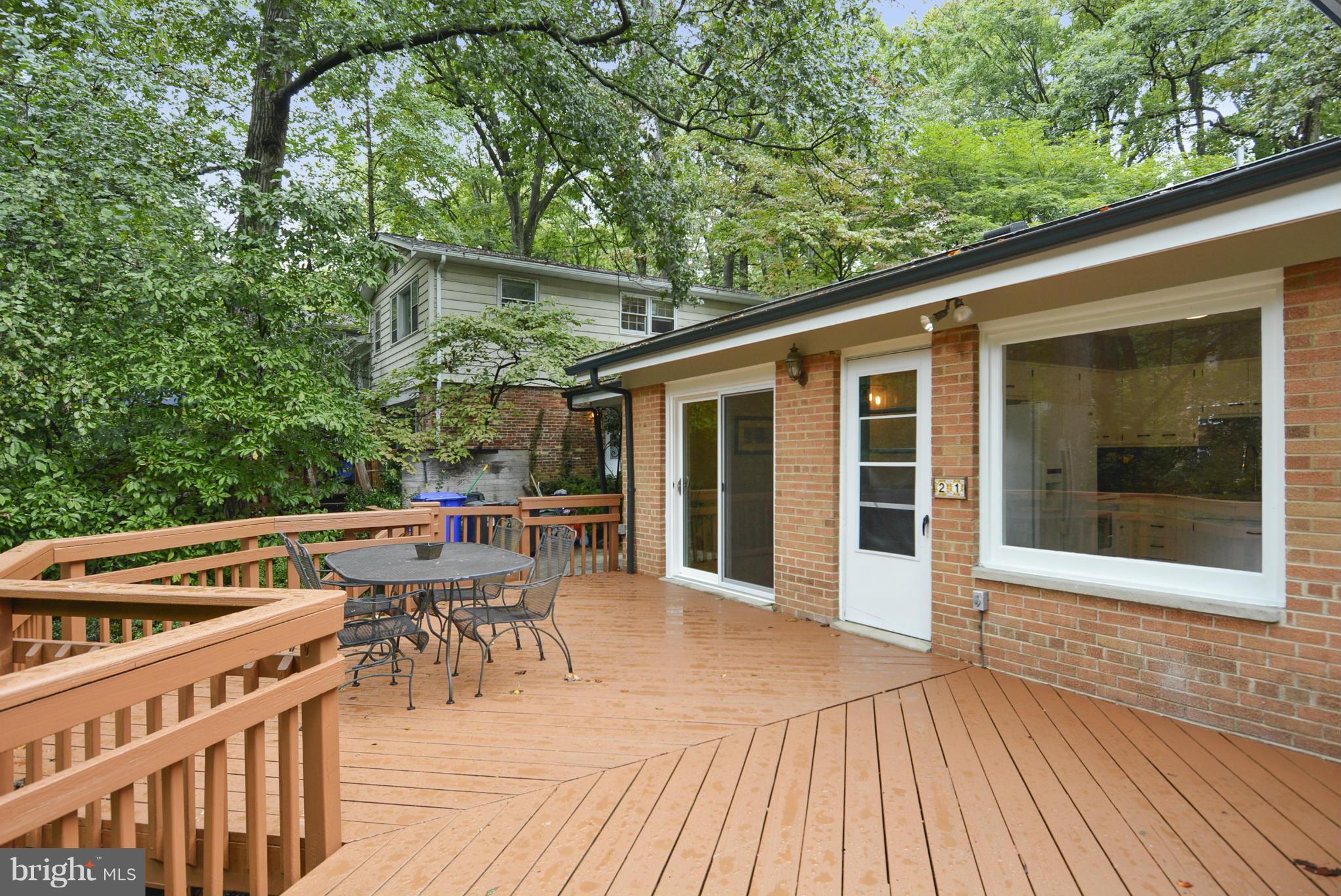 21 Parkside Road Silver Spring, MD 20910 - Photo 19 of 29 a view of a patio with table and chairs with wooden floor and fence