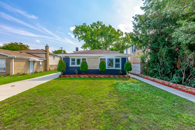 a view of an house with backyard space and balcony