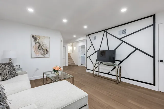 a workspace with furniture and wooden floor