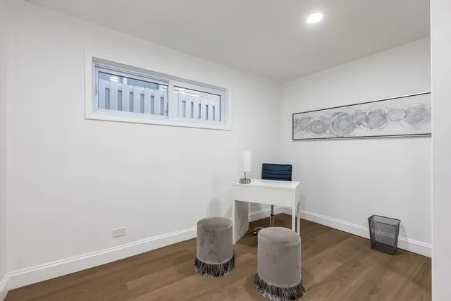 a work room with furniture and wooden floor