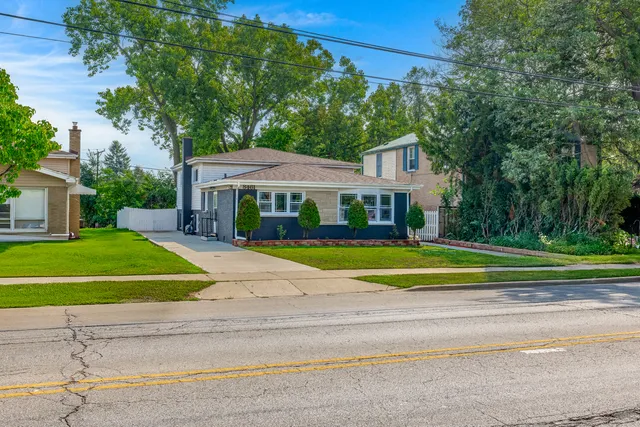 a view of a deck with chairs and floor to ceiling window