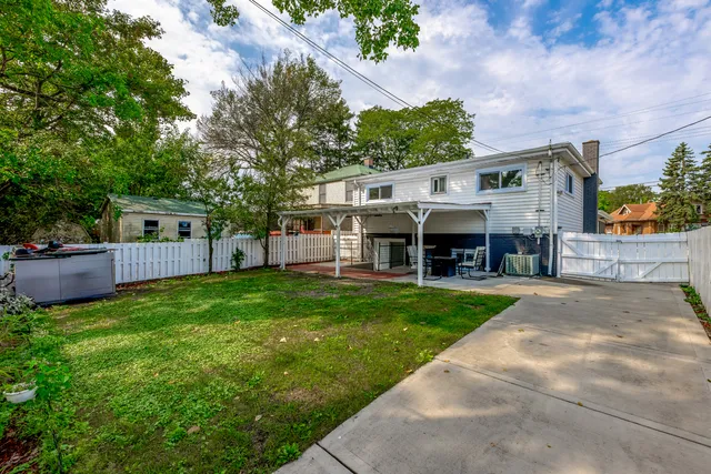 a patio with yard table and chairs