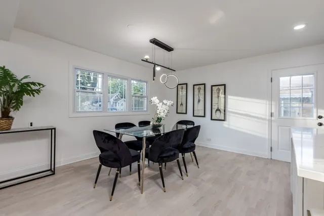 a view of a dining room with furniture and window