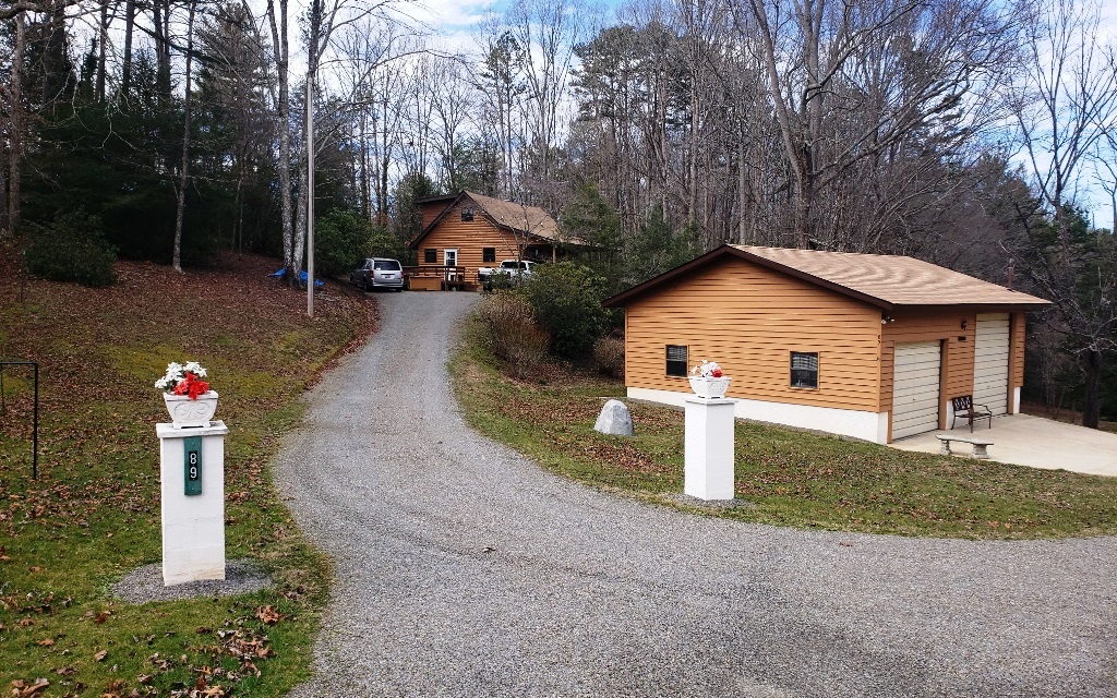 89 Hunter Vly Road Murphy, NC 28906 - Photo 1 of 1 a front view of a house with a yard and garage