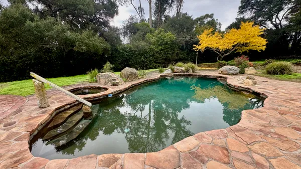 a kitchen with a stove sink and refrigerator
