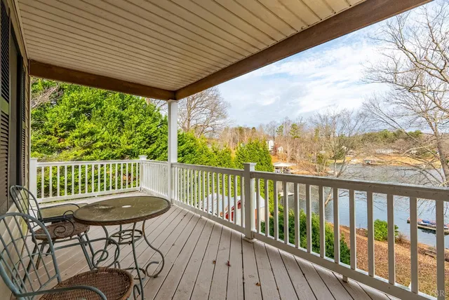 a view of balcony with wooden floor and outdoor seating