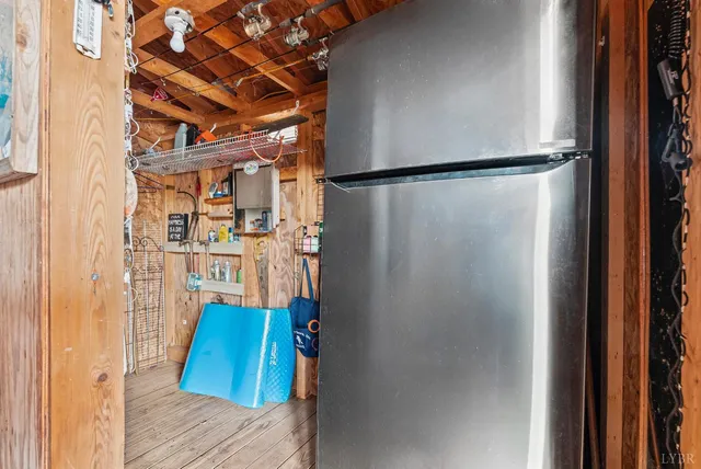 an aerial view of lake and residential houses with outdoor space