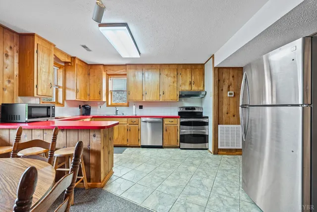 a kitchen with a sink and a window