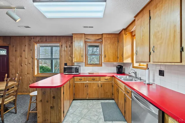 a kitchen with a stove a sink and a refrigerator