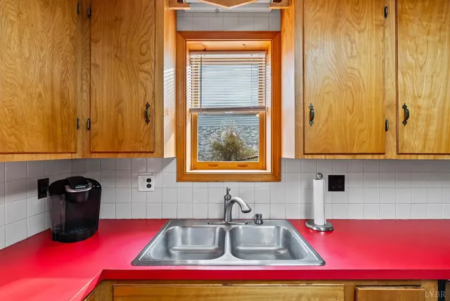 a kitchen with stainless steel appliances granite countertop a refrigerator and a stove